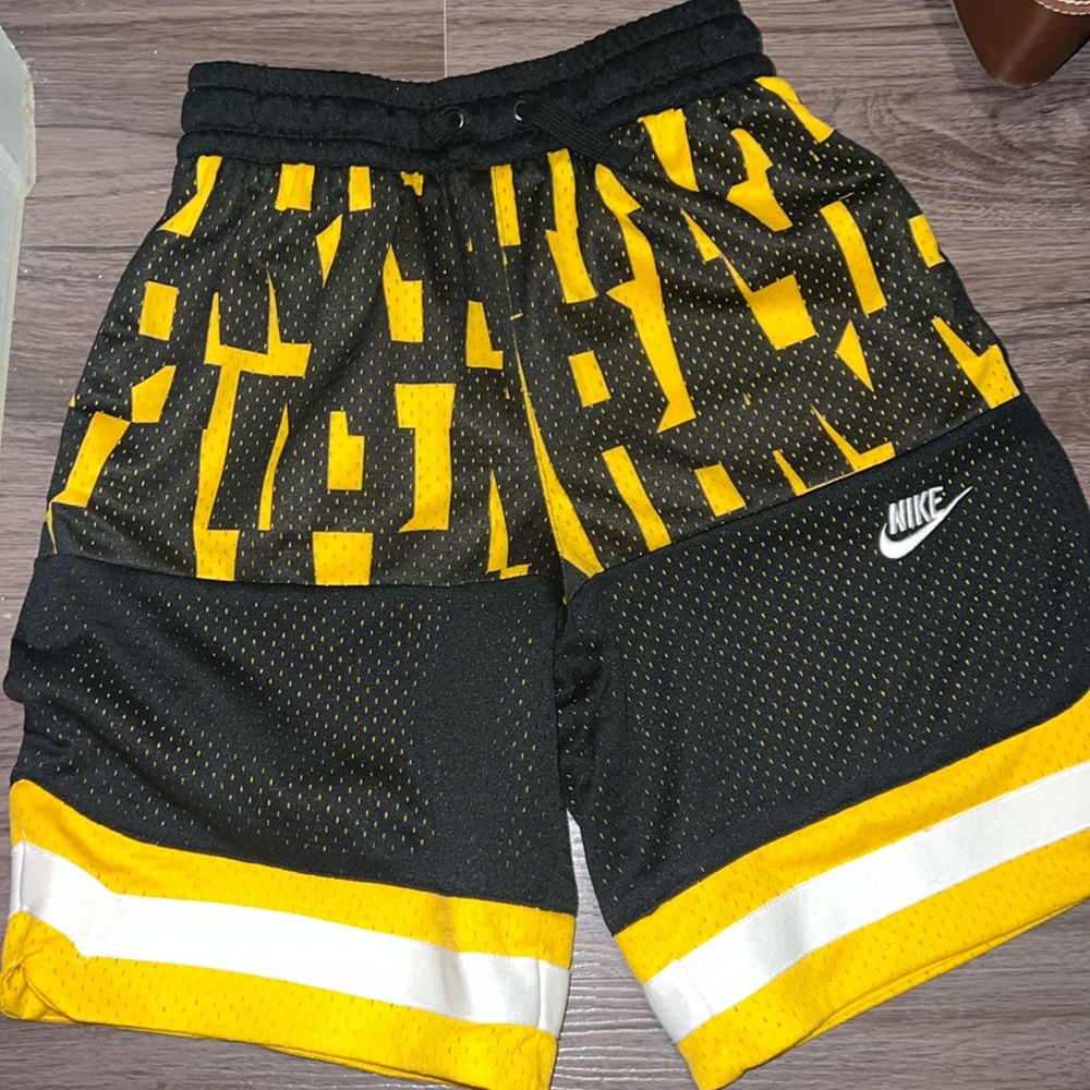 Black and yellow Nike basketball shorts
